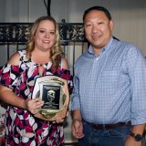 Amy Ward presents Ag Supporter award to Aaron Fakuda of the Kings County Fakuda family.